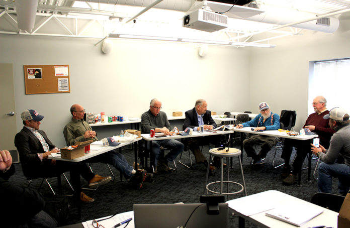 Photo of (Left to right) Danny Acciavatti, Bill Molnar, Jim Struble, Frank Mamat, Pat Acciavatti, and Doug Cryderman talk with Keith Ledbetter in a SEMCA classroom at the first Legacy Committee meeting