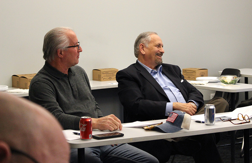 Photo of Jim Stuble (left) and Frank Mamat (right) enjoy hearing tales of the start of ABC SEMI